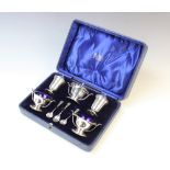 A boxed silver condiment set by Deakin & Francis, Birmingham 1938, comprising wet mustard, two