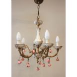 A pair of porcelain and gilt metal five branch chandeliers, 20th century, each adorned with