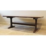 A 17th century style oak refectory table, the associated rectangular slab top raised upon a pair