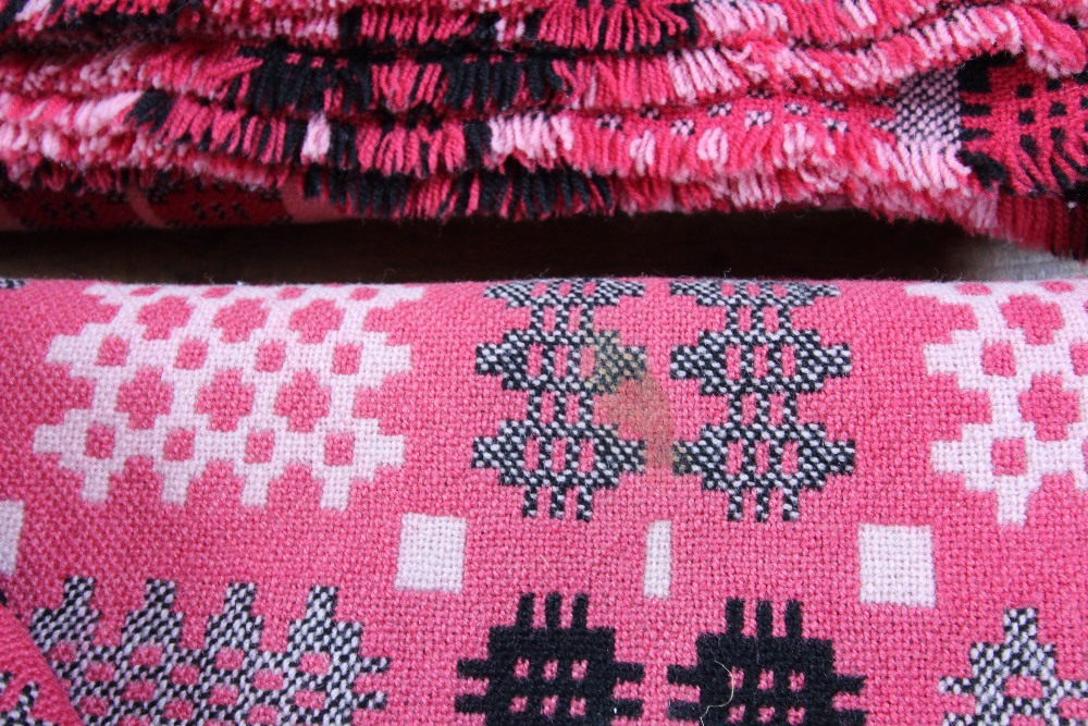 A pair of Welsh blankets, of traditional reversible geometric design in washed red, pink and - Image 4 of 4