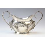 An Edwardian twin-handled silver sugar bowl by Joseph Gloster, Birmingham 1901, of oval form with