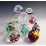 A collection of ten paperweights, to include canework, millefiori and swirled examples by makers