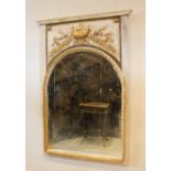 A French Neo-classical style pier mirror, with arched bevelled mirror plate below a gilt relief