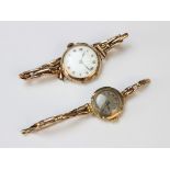 A Lady's vintage 9ct gold wristwatch, the round white enamel dial with Roman numeral markers set
