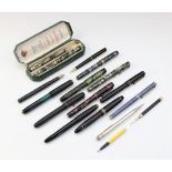 A selection of antique and vintage pens and pencils, to include; a Victorian/Edwardian ebonised wood
