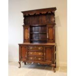 A George III style oak and mahogany cross banded Welsh dresser, 20th century, the moulded cornice