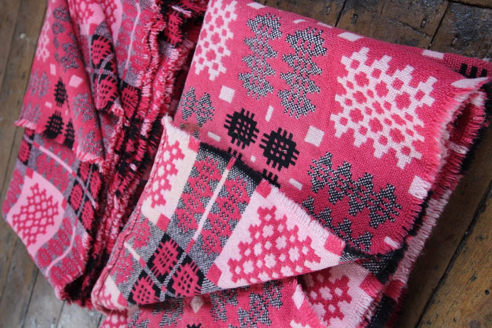 A pair of Welsh blankets, of traditional reversible geometric design in washed red, pink and - Image 3 of 4