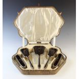 An Art Deco silver mounted and tortoiseshell inlaid six-piece dressing table set by I S