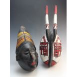 A West African Nigerian Ibibio black painted mask, 35cm high, and a West African Mossi painted