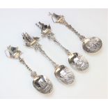 Three Dutch silver spoons, each designed with pictorial bowl depicting harbour, lock and light house