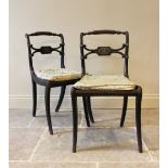 A pair of Regency ebonised Trafalgar dining chairs, the crest rail extending to rope twist detail on