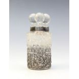 An Edwardian silver mounted set of three cut glass scent bottles and stoppers by Collyer & Co,