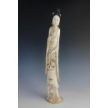 A large Chinese carved ivory figure of Guanyin, 19th century, finely carved depicting the figure