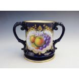 A Royal Worcester loving cup, early 20th century, of typical form and large proportions, decorated