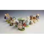A collection of seven Beswick Beatrix Potter figures, comprising: Goody & Timmy Tiptoes, Hunca Munca