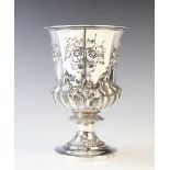 A William IV silver chalice, London 1834, of pedestal form and later embossed with foliate