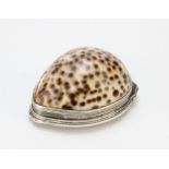 A 19th century white metal mounted cowrie shell snuff box, the hinged cover embossed with flora