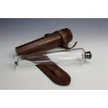 A clear glass hunting flask in leather case, early 20th century, the conical flask with white metal,