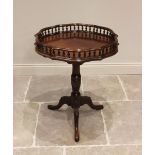A 19th century and later Chippendale style mahogany tripod table, the shaped top with a repeating