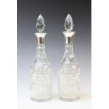 A pair of George V cut glass silver mounted decanters by Henry Clifford Davis, 1927 Birmingham, each