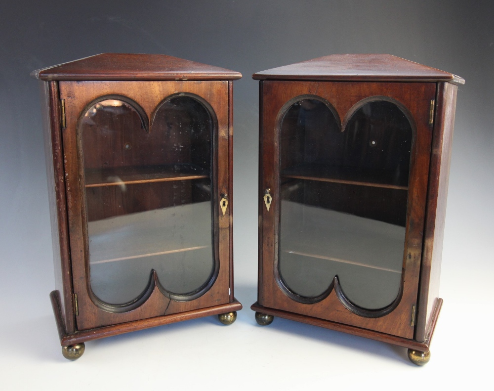 A pair of 19th century and later mahogany freestanding desk top display cabinets, of architectural