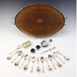 An oak inlaid white metal mounted twin-handled gallery tray, of oval form on four compressed ball