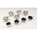 A selection of silver mustard pots and salts to include; a pair of open salts by James Swann,