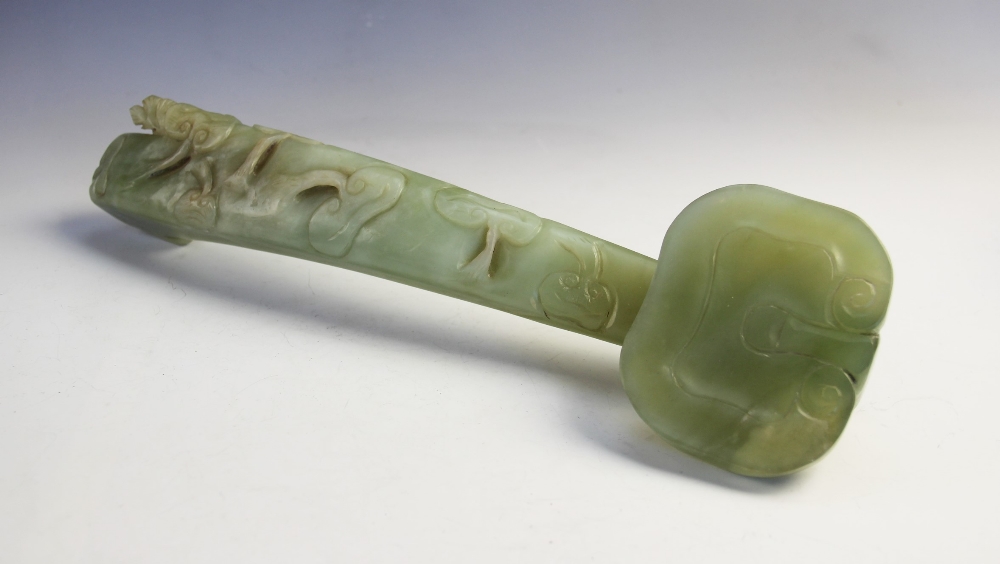 A Chinese jade ruyi sceptre, 20th century, the sceptre of large proportions carved with lotus blooms