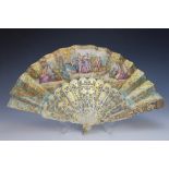 A fan, 19th century, the intricately pierced and gilt highlighted bone sticks, supporting a printed,