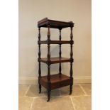 A Victorian mahogany etagere/what-not, designed as four tiers with a single drawer to the base,