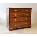 A George III oak and mahogany cross banded chest of drawers, the top inlaid with barber pole