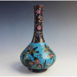 A Chinese cloisonne vase, 19th century, of slender bottle form decorated with two birds amidst