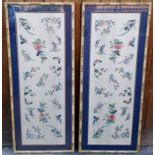 A pair of Chinese embroidered silk panels, early 20th century, each depicting exotic birds,