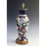 A Japanese imari lamp base, 20th century, of baluster form, set to a turned oak base, 44cm high