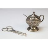 A Victorian silver mustard pot by L Spiers, Birmingham 1892, of baluster form with embossed floral