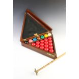 An Edwardian mahogany snooker compendium, of triangular form, opening to reveal original triangle