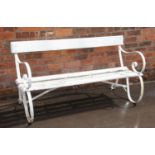 A 19th century painted iron and hardwood bench, the pair of scrolling strapwork supports united by a