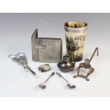 A selection of white metal cutlery and accessories, to include; a George V silver wick burner, 5cm