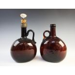 A near pair of brown glass decanters and cork stoppers, 19th century, one with 'Port' stopper, 24.