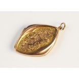 An early 20th century 9ct gold locket, the diamond shaped locket with foliate engraved panels to