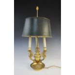 A Regency style ormolu student's lamp, modelled as a central vase issuing three swan form