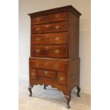 An 18th century and later constructed, oak and mahogany crossbanded chest on stand, designed as