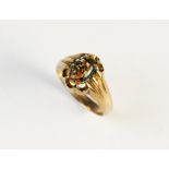 A moss agate set ring Chester 1936, the oval cabochon (measuring 10mm x 7mm) claw set in 9ct gold,