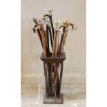 A collection of twenty two walking sticks, 19th century and later, to include a brass mounted Jaguar