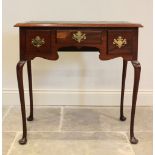 A George III style mahogany low boy/writing desk, early 20th century, the rectangular moulded top