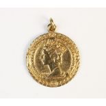 A 9ct gold pendant commemorating the silver jubilee of Queen Elizabeth II, marks for 'EJ Ltd',