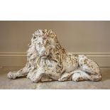 A cast iron lion, modelled recumbent and white painted, 37cm high, 69cm wide