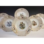 Twelve Meissen style porcelain ornithological plates, 20th century, each centrally enamelled with a