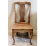 A pair of George II walnut side chairs, possibly Irish, the vase shaped splat above a board seat,