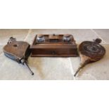 A Victorian rosewood desk tidy, of country house proportions, the three glass bottles flanked by pen